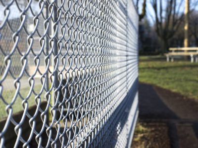 Metal Fence Cage Closeup In A Park